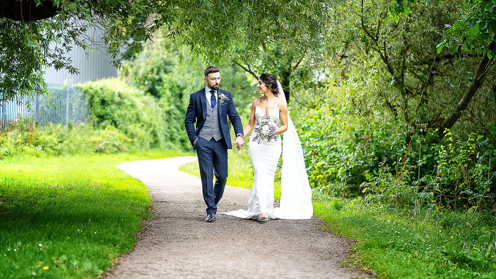 Bride and Groom Walking in Nature walkway